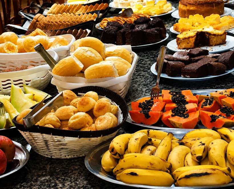Breakfast buffet with breads, cakes and fresh fruit